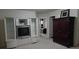 Spacious living room with entertainment center, furniture, and neutral carpet at 2162 Oakland Grove Pl, Lawrenceville, GA 30044