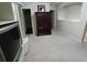 Neutral living room featuring an entertainment center and large carpeted space at 2162 Oakland Grove Pl, Lawrenceville, GA 30044