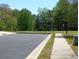 View of a parking lot with curb and grass at 2162 Oakland Grove Pl, Lawrenceville, GA 30044