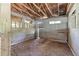 Interior of a barn featuring a dirt floor, exposed framing, and natural light at 2320 Copper Trail Ln, Buford, GA 30519