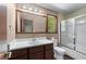 Classic bathroom featuring a shower and vanity at 2320 Copper Trail Ln, Buford, GA 30519