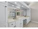 Bright bathroom with double sinks, ample counter space, and a large mirror with modern lighting at 2320 Copper Trail Ln, Buford, GA 30519