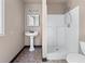 Cozy bathroom featuring pedestal sink and shower at 2320 Copper Trail Ln, Buford, GA 30519
