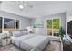 Serene bedroom features neutral decor, a large bed, and plenty of natural light at 2320 Copper Trail Ln, Buford, GA 30519