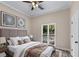 Comfortable bedroom with a large window, neutral decor, and a cozy atmosphere at 2320 Copper Trail Ln, Buford, GA 30519
