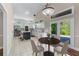 Bright kitchen with white cabinets, stainless steel appliances, and a breakfast area with a backyard view at 2320 Copper Trail Ln, Buford, GA 30519