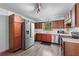 Well-lit kitchen features wood cabinets, stainless steel appliances, and a window view at 2320 Copper Trail Ln, Buford, GA 30519