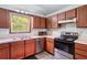 Bright kitchen with stainless steel appliances and wood cabinets offers a delightful cooking space at 2320 Copper Trail Ln, Buford, GA 30519