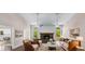 Bright and airy living room with hardwood floors, a fireplace, and multiple windows offering natural light at 2320 Copper Trail Ln, Buford, GA 30519