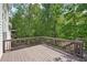 Outdoor deck surrounded by lush trees and natural beauty at 553 Augusta Dr, Canton, GA 30115