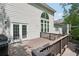 Outdoor deck with a grill and surrounded by lush trees and natural beauty at 553 Augusta Dr, Canton, GA 30115