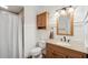 Bathroom featuring vanity, white wainscoting, and neutral decor at 553 Augusta Dr, Canton, GA 30115