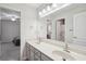 Bright bathroom with a double vanity and a mirror at 553 Augusta Dr, Canton, GA 30115