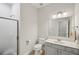 Modern bathroom with glass shower, toilet, vanity, and brushed nickel fixtures at 553 Augusta Dr, Canton, GA 30115