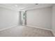 Bedroom with gray walls, plush carpet, and natural light from a window at 553 Augusta Dr, Canton, GA 30115