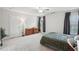 Spacious bedroom featuring plush carpet, natural light, and ample closet space at 553 Augusta Dr, Canton, GA 30115
