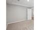 Spacious bedroom with plush carpet, recessed lights, and neutral walls at 553 Augusta Dr, Canton, GA 30115