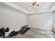 Bright room with carpet and modern ceiling fan, suited as an exercise room at 553 Augusta Dr, Canton, GA 30115