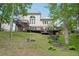 Rear view of home with multilevel deck and landscaped yard, perfect for outdoor living and entertaining at 553 Augusta Dr, Canton, GA 30115