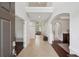 Grand foyer with soaring ceilings, decorative wainscoting, and a view through to the formal living area at 553 Augusta Dr, Canton, GA 30115
