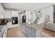 Bright kitchen features stone countertops, stainless appliances, and an island at 553 Augusta Dr, Canton, GA 30115