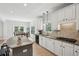 Bright kitchen with an island with bar stool seating and a dining table at 553 Augusta Dr, Canton, GA 30115