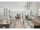 Bright kitchen with granite countertop island and sink, and view to dining table at 553 Augusta Dr, Canton, GA 30115