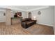 Open-concept living area with hardwood flooring and a comfortable seating arrangement at 553 Augusta Dr, Canton, GA 30115