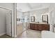 Luxurious bathroom showcasing a glass enclosed shower and and sink vanities at 553 Augusta Dr, Canton, GA 30115