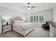Spacious main bedroom with tray ceiling, soft carpet, and natural light from window at 553 Augusta Dr, Canton, GA 30115