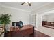 Bright office space featuring hardwood floors, large desk, and French doors at 553 Augusta Dr, Canton, GA 30115