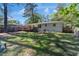 An expansive backyard offers a large lawn and a charming deck, perfect for outdoor enjoyment and entertaining at 705 Stewart Nw Cir, Marietta, GA 30064