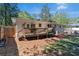 A backyard view shows a raised deck, wooden privacy fence, and a well-manicured yard at 705 Stewart Nw Cir, Marietta, GA 30064