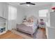 Bedroom with hardwood floors, a light colored rug, and a floral patterned bed, and desk area at 705 Stewart Nw Cir, Marietta, GA 30064