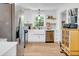 Bright and airy kitchen with white cabinetry, stainless steel appliances, and hardwood flooring at 705 Stewart Nw Cir, Marietta, GA 30064