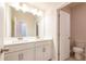 Bathroom featuring double sink vanity and tile flooring at 7505 Woolf Way, Cumming, GA 30028
