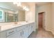 Modern bathroom featuring double sink vanity, quartz countertop and large glass shower at 7505 Woolf Way, Cumming, GA 30028