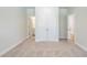 Spacious bedroom with a carpet floor, closet, and an en-suite bathroom at 7505 Woolf Way, Cumming, GA 30028
