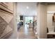 Bright foyer with sight lines to the kitchen, dining area and stairway at 7505 Woolf Way, Cumming, GA 30028