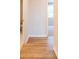 Hallway with wood flooring leading to bathroom and bedroom at 7505 Woolf Way, Cumming, GA 30028