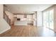 Bright kitchen featuring white cabinets, stainless steel appliances, and sliding glass doors at 7505 Woolf Way, Cumming, GA 30028