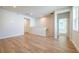Bright living room features hardwood floors, recessed lighting and access to other rooms at 7505 Woolf Way, Cumming, GA 30028