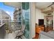 Inviting balcony setup with comfortable seating, offering views of the cityscape and building architecture at 1080 Peachtree Ne St # 3213, Atlanta, GA 30309