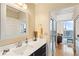 Bright bathroom vanity featuring dark cabinetry, a stylish framed mirror, and modern fixtures at 1080 Peachtree Ne St # 3213, Atlanta, GA 30309