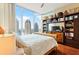 This modern bedroom has hardwood floors, natural lighting and a built in bookcase at 1080 Peachtree Ne St # 3213, Atlanta, GA 30309