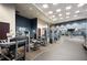 Modern fitness center with a variety of exercise equipment and mirrored walls at 1080 Peachtree Ne St # 3213, Atlanta, GA 30309
