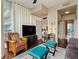 Living room with a wall-mounted television, stylish furniture, hardwood floors, and sliding closet doors at 1080 Peachtree Ne St # 3213, Atlanta, GA 30309