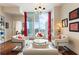 Elegant living area with floor-to-ceiling windows, comfortable seating, cityscape views, and sophisticated décor with hardwood floors at 1080 Peachtree Ne St # 3213, Atlanta, GA 30309