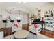 Open-concept living area with a piano, and a stylish kitchen, complemented by modern furnishings and hardwood floors at 1080 Peachtree Ne St # 3213, Atlanta, GA 30309