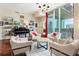 Spacious living room features cityscape views, comfortable seating, a piano, and sophisticated decor with hardwood floors at 1080 Peachtree Ne St # 3213, Atlanta, GA 30309